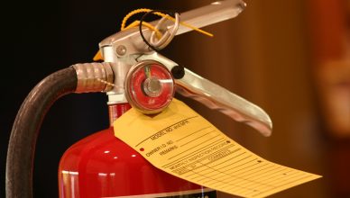 Portable fire extinguisher with tag tested to NFPA 10-2018