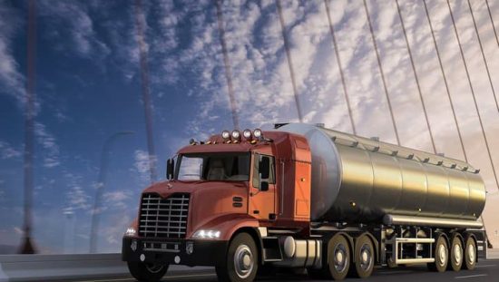 A new truck crossing a suspension bridge to deliver cryogenic liquids in accordance with CGA 341-2017.