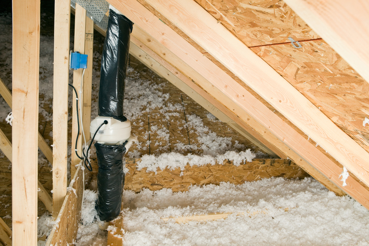 A black pipe in attic using ANSI/AARST CC-1000-2018 guidance for radon mitigation.