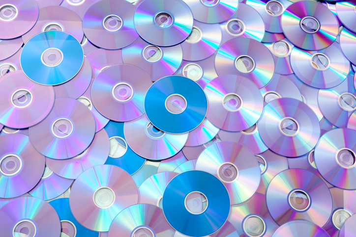 A pile of CDs that follow ISO IEC 13818