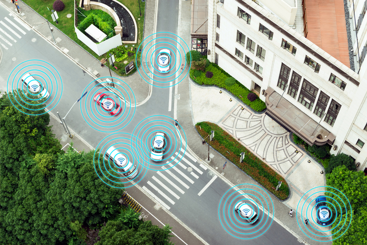 Five cars on street depending on automated driving systems outlined in SAE J 3016-2018.