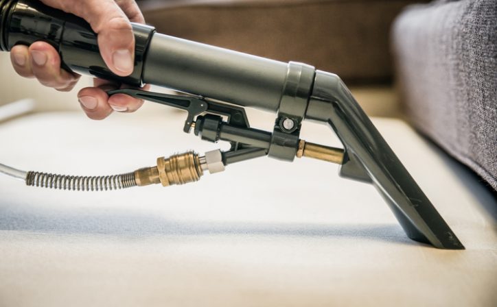 Closeup of ANSI/IIICRC vacuuming equipment conducting cleaning restoration.