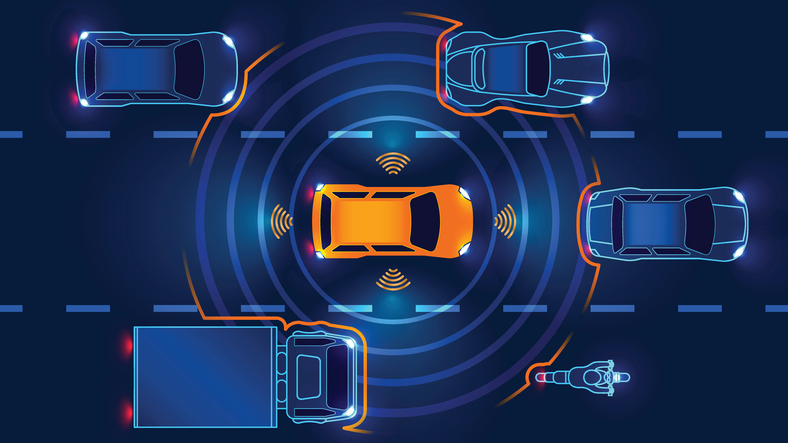 Orange car operating at Level 1 of the SAE levels of driving automation