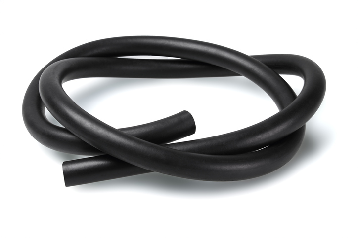 A black rubber automotive hose on white background classified to ASTM D2000-18.