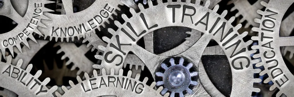 Gears of knowledge show the difference in training between ANSI ASSP Z490.1 and Z490.2