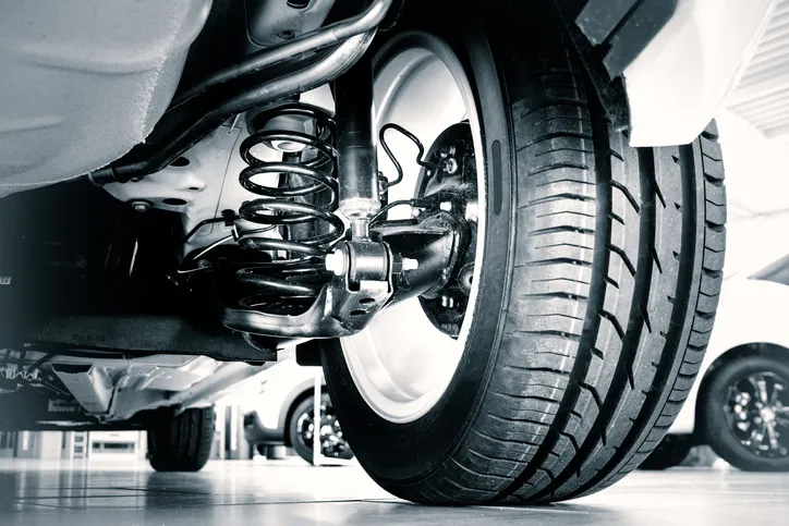 Rubber car tire in shop classified to ASTM D2000-18.