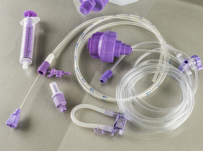 Plastic tubes lying around after leaving ISO 15747:2018 plastic containers.
