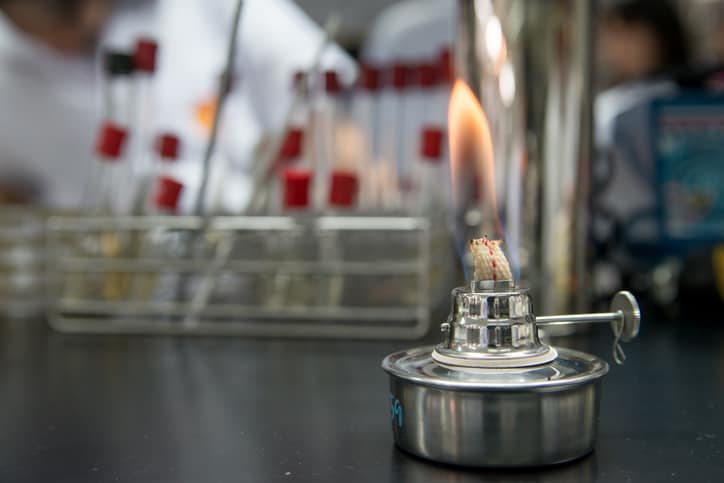 A bunsen burner alight and adhering to NFPA 45 2019 for laboratory chemicals