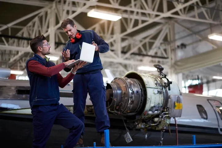 Aircraft Mechanics working with 3D technology additive manufacturing
