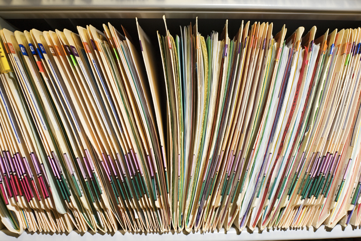 Folders on their side following a records management system.