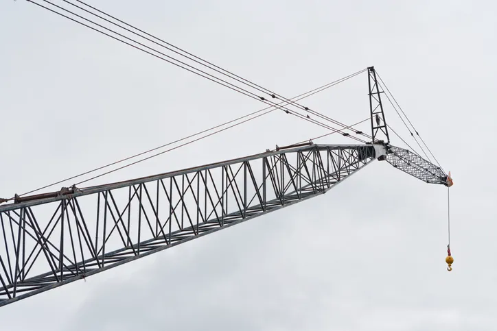 Crane with the hook on the end that follows safety guidelines set in ASME B30.10