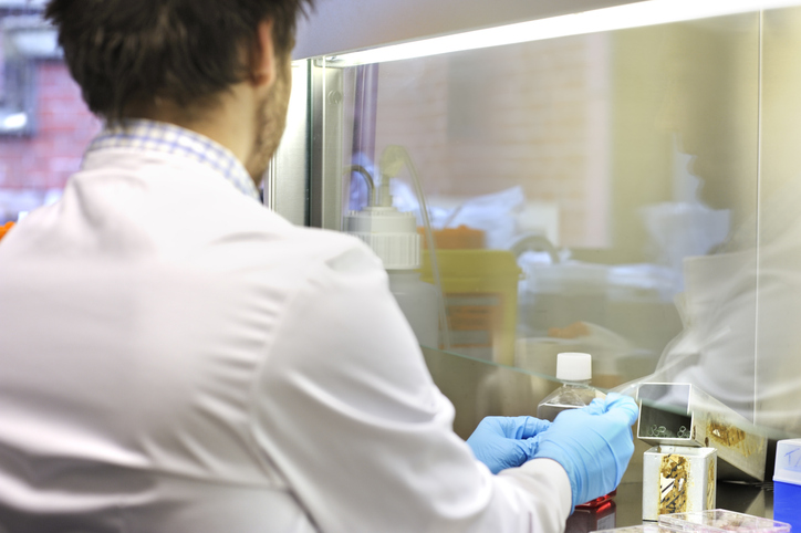 Worker using fume hood for Laboratory Ventilation