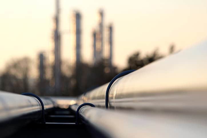 Oil Refinery Pipes Two API 579-1/ASME FFS-1-2016 pipes lead into petrochemical plant to provide fitness-for-service.