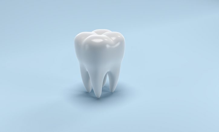 Visualized bright tooth on blue background with no adhesion problems thanks to ANSI/ADA 111-2019 testing