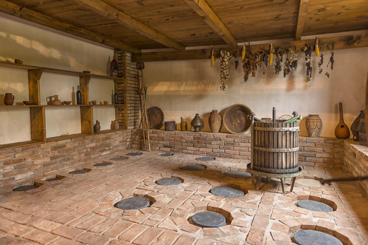 Wine press in a classical Georgian wine cellar, deep in a basement in Kakheti.