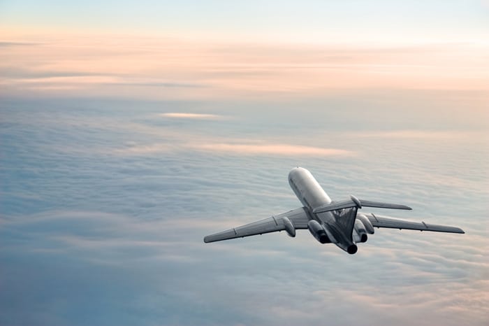 Airplane A sunrise plane journey moves smoothly above the clouds thanks to AS 9100 Series Standards.