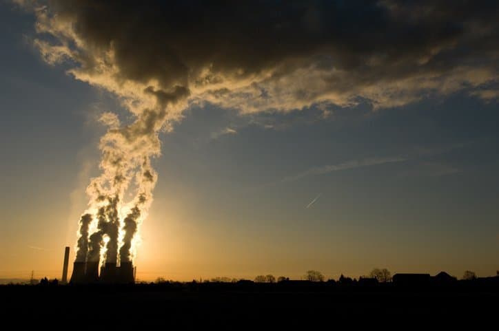 Reporting Greenhouse Gas Emissions Power plant emits smoke and in need of ISO 14064 standards for quantifying greenhouse gas emissions.