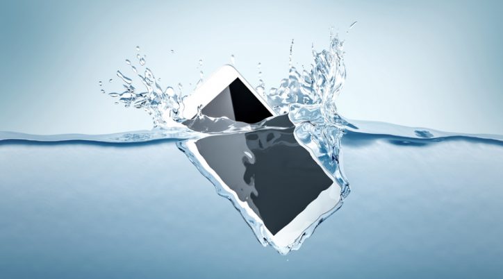 A smartphone plummets into the water and is destroyed due to a low IP Code rating under IEC 60529.