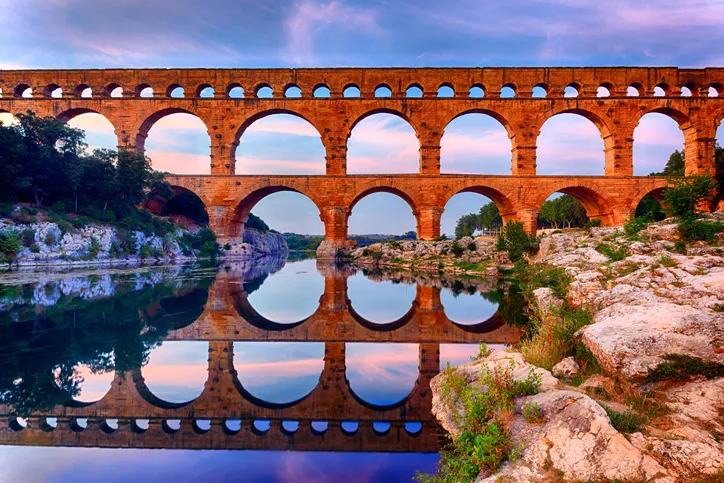 Colorful photo of Pont du Gard, a Roman aqueduct that transferred drinking water using lead.