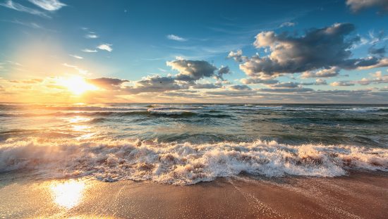 A sunset cast over the receding tide demonstrates the future of accreditation relating to the Carbon XPRIZE.