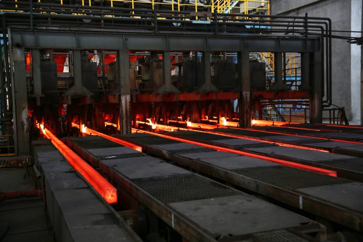 Red molten steel oozing and measured by AMS 2750F-2020 pyrometry specifications through ISO/IEC 17025 accreditation.
