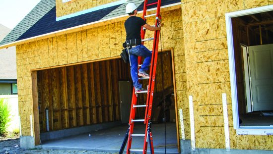Construction worker climbing red metal extension ladder with three points of contact and basic safety tips.