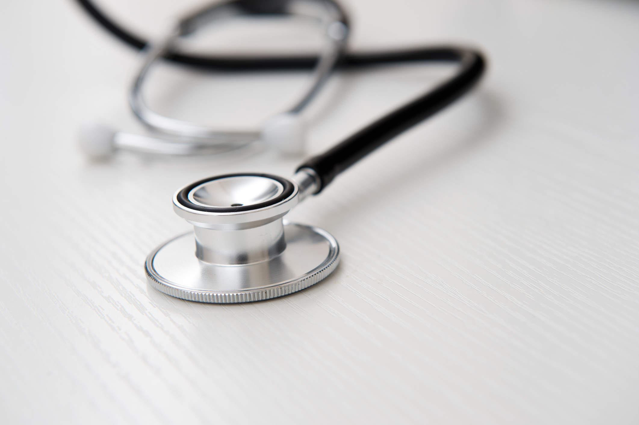 Medical Device Stethoscope on wood adhering to ISO 15223-1:2021 for symbols on medical device labels.