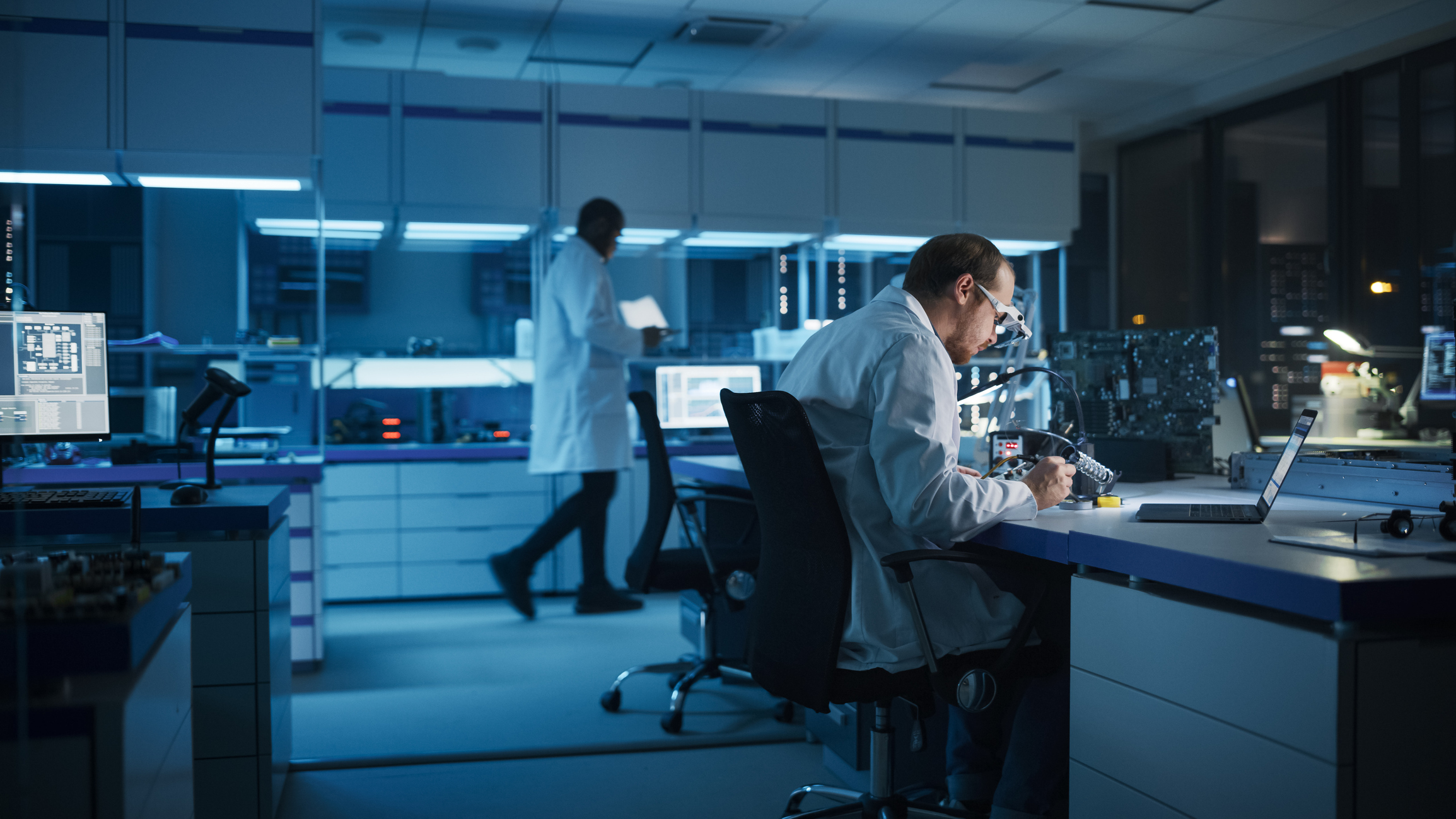 Lab technicians working on statements of conformity to prepare for ISO/IEC 17025 accreditation.